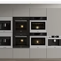Modern Built In Kitchen Appliances Including Ovens Coffee Machine And Cabinets