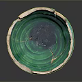Broken Ceramic Bowl With Green And White Glaze Cracks And Chips