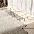 Square Textured Rug on Wooden Floor with White Curtains and Natural Light