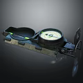 Green Military Style Compass with Ruler Scale Fluorescent Markers and Metal Casing on Dark Background