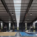 Modern Basketball Gym Interior With Hanging Lights Spectator Seats And Service Counter