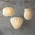 Elegant Beige Paper Lanterns Hanging As Pendant Lights With Pleated Design And Bamboo Leaves