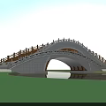 Wooden Arched Bridge Over Water With Lotus Leaves And Blue Sky Reflection