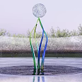 Spherical Sculpture With Green Blue Curved Pillars In Circular Pool And Trees Metal Fence