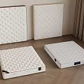 White Mattresses Featuring Quilted And Dotted Patterns On Wooden Floor 3d model