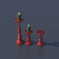 Three Red Candle Holders With Green Candles Two Lit For Home Decoration