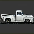 Vintage White Pickup Truck Displayed On Platform With Weathered Exterior Details