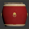 Red Musical Drum Featuring Golden Decorative Rings And Wooden Drumsticks On Surface