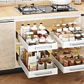 Organized Kitchen Tools And Spice Jars Storage In White Drawers With Light Wooden Cabinets