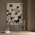 Abstract Wall Painting With Circular Patterns Brown Green Yellow Near Wooden Stool Books And Vases