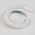 C Shaped Spiral Building Design Featuring White Structure And Golden Trim