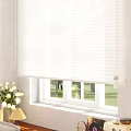 White Window Blinds In Bright Living Room With Green Outdoor View
