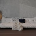 Light Sectional Sofa Featuring Faux Fur Throw Dark Cushion Wooden Legs Gray Wall