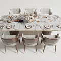 Elegant Marble Top Dining Table Set With Six Woven Chairs And Decorative Centerpiece