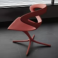 Stylish Red Modern Curved Chair With Unique Design And Crossed Legs In Interior Room