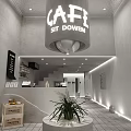 Cafe Interior Design with Sit Down Sign Gray Walls Lighting Counter and Staircase