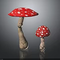 Large and Small Red Mushrooms with White Spots and Brown Stems on Black Background