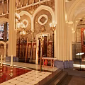 Sacred Church Interior With Stained Glass Window Arched Structures And Memorial Walls