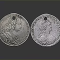 Two Vintage Silver Coins Each With Engraved Portraits And Detailed Patterns