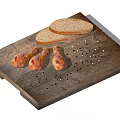 Roasted Chicken Drumsticks With Bread Slices On Wooden Cutting Board And Black Peppercorns