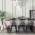 Elegant Dining Table Set With Black Chairs Tablecloth And Flower Centerpieces