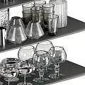 Modern Glass Tableware Set with Cups Bottles Goblets and Jars on Display Shelves