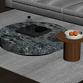Round Marble Coffee Table with Tray Glass Bottle and Wooden Side Table Holding Fruit Bowl