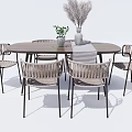 Round Wooden Dining Table Set with Rattan Chairs Metal Frames and Dried Flower Decor