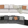 Multi Seater Sofa With Grey White Upholstery Brown Grey Pillows Knit Blanket And Side Table