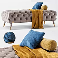 Tufted Gray Sofa Bench With Gold Legs Yellow Blanket And Blue Cushion