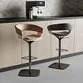 Modern Kitchen Interior With Stylish Brown And Black Bar Stools By Counter Area