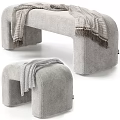 Gray Upholstered Ottoman Bench With Fringed Throw Blanket And Minimalist Design