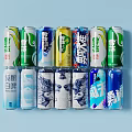 Assorted Canned And Bottled Beverages With Various Different Colorful Designs