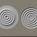 Two White Round Ceiling Light Panels With Concentric Circle Patterns On Beige Wall