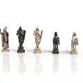 Black And Silver Chess Pieces With Intricate Design On Reflective White Surface