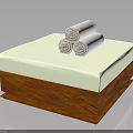Wooden Storage Box With Light Green Mat And Three Rolled White Towels