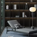 Modern Gray Lounge Chair With Geometric Cushion And Round Floor Lamp By Dark Bookshelf