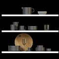 Stylish Kitchenware Display On White Shelves With Mugs Bowls Plates And Chopping Board