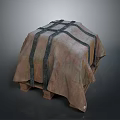 Household Item Covered With Brown Fabric And Cross Tied Black Straps On Wooden Pallet