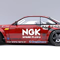 Red Racing Car Featuring Sponsor Logos Modified Exterior And Sporty Wheels