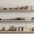 Elegant Tea Ware Display On Wooden Shelves With Teapots Teacups Tea Cakes And Jars