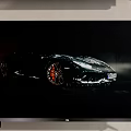 Modern Television Screen Displaying Black Sports Car With High Quality Visuals