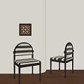 Dining Chairs With Black Metal Frames And Black White Striped Cushions Against Light Colored Walls