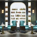 Elegant Wine Cellar Interior With Wine Bottles On Racks Blue Armchairs And Small Round Tables