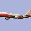 Commercial Passenger Airplane With White Fuselage Orange Tail And Four Engines