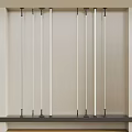 Interior Scene With Vertical Metal Rods On White Wall And Dark Countertop