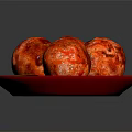 Appetizing Four Baked Meatballs Served on Red Plate with Fresh Green Leaf