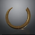 Golden Circular Metal Sculpture With Shiny Surface And Curved Design Details