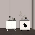 White Bedside Tables With Gold Accents And Decorative Plants On Top Surface