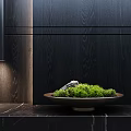 Green Moss In Ceramic Bowl On Marble Counter With Dark Wooden Wall And Soft Lighting